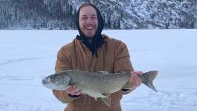 Ice Fishing For Lake Trout On A Remote Lake In Alaska